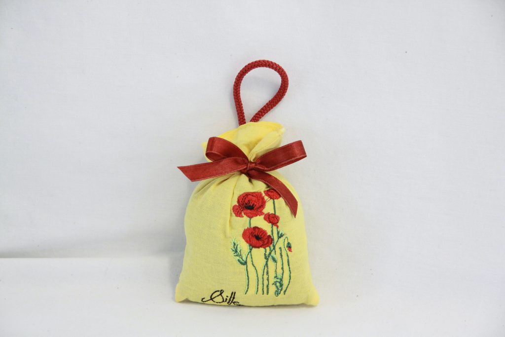 Yellow lavender sachet with poppy embroidery, adorned with a red ribbon, French craftsmanship.